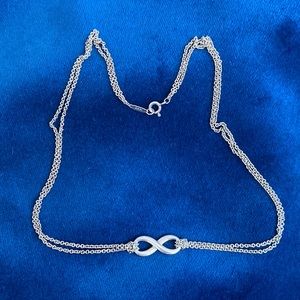 Tiffany & Co Infinity pendant necklace. 16 inches.